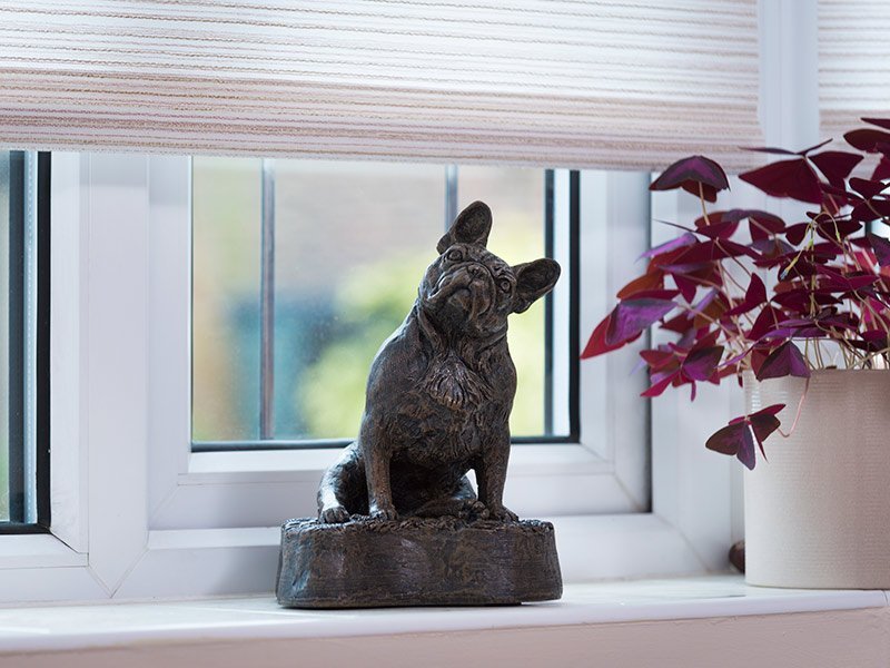 PETRIBUTES_PUG Our lovely figurine ashes urns are so discreet and look lovely in any setting. Sculptured ornamental ashes urns caskets for pets.