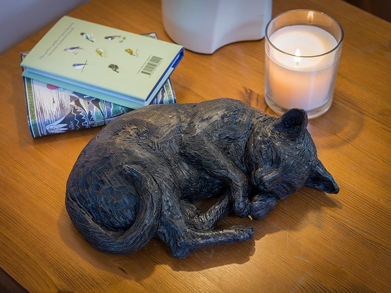 PETRIBUTES_RESTING-CAT_03 Our lovely figurine ashes urns are so discreet and look lovely in any setting. Sculptured ornamental ashes urns caskets for pets.