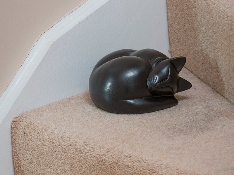 PETRIBUTES_SLEEPING-CAT Our lovely figurine ashes urns are so discreet and look lovely in any setting. Sculptured ornamental ashes urns caskets for pets.